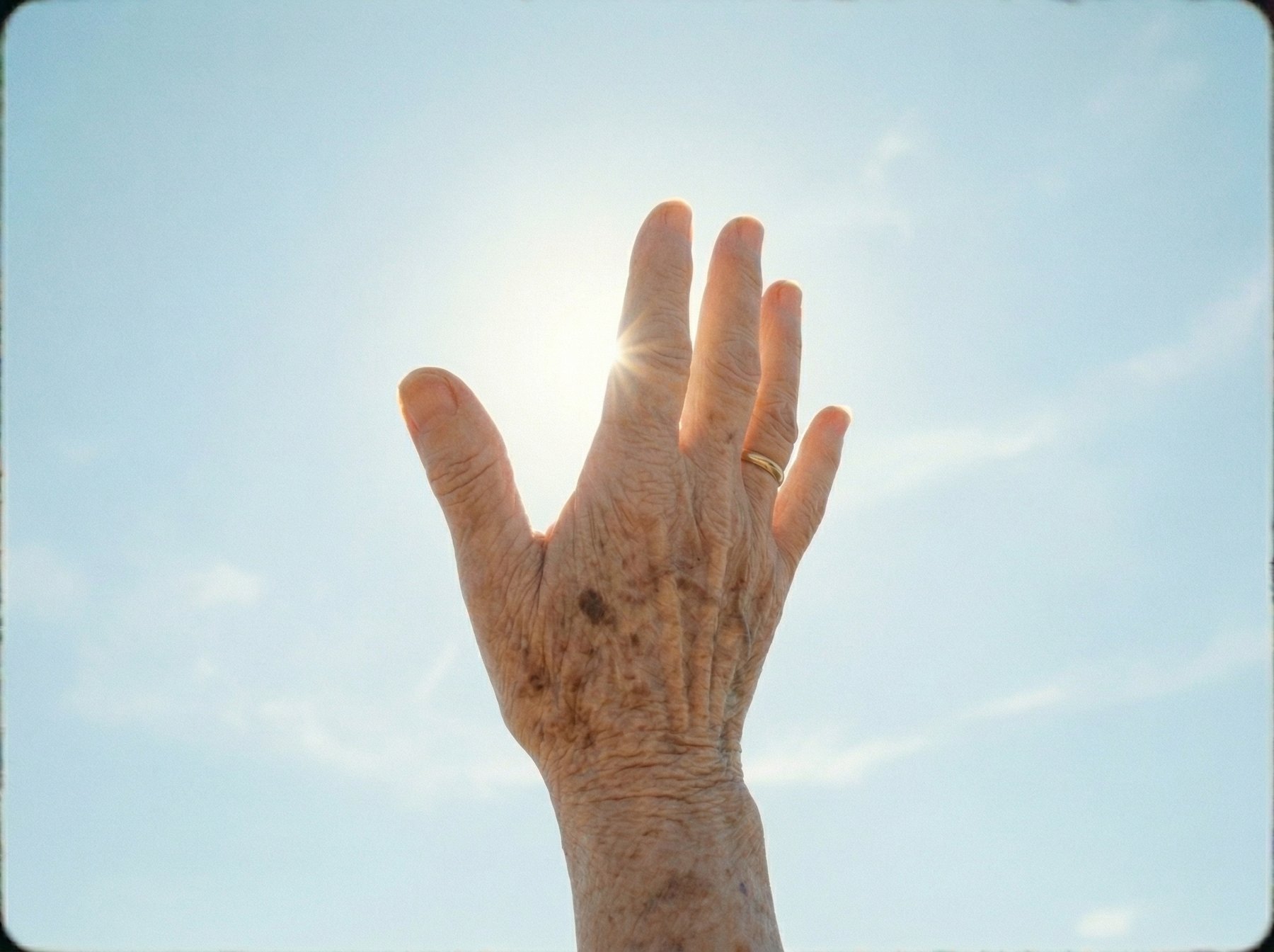 Hand raised to the sky
